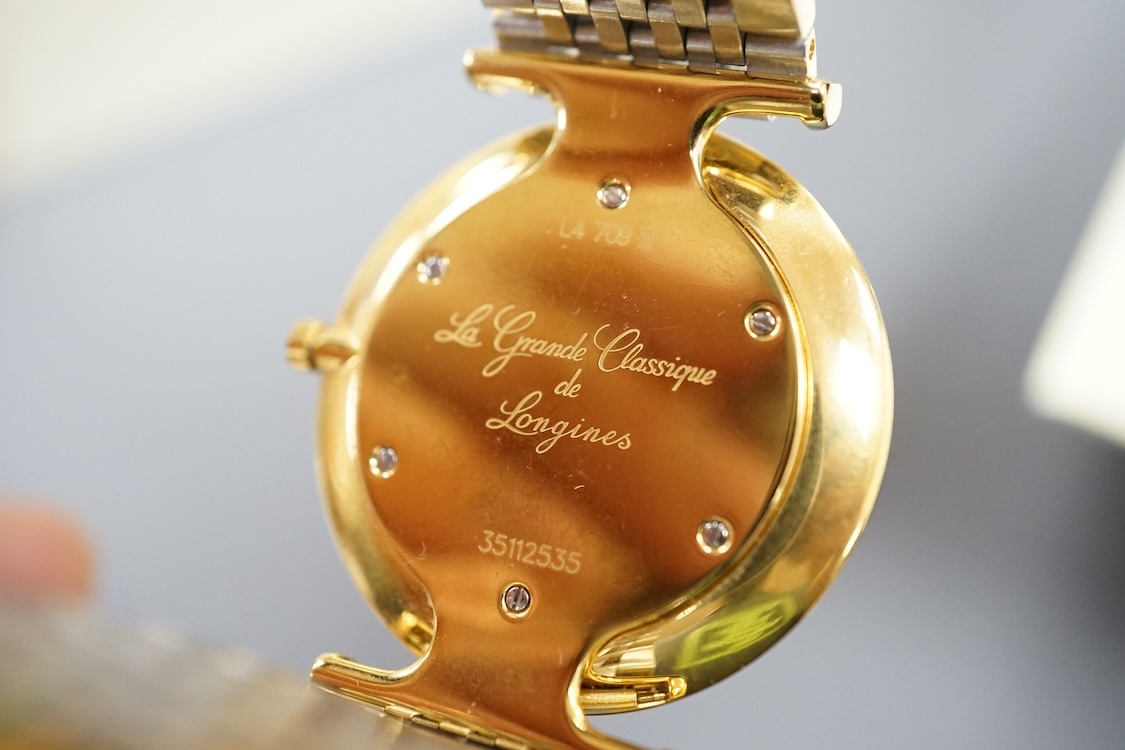 A gentleman's gtwo tone gilt steel Longines L4709-2 Le Grand Classique quartz dress wrist watch, with Roman dial, case diameter 33mm, boxed